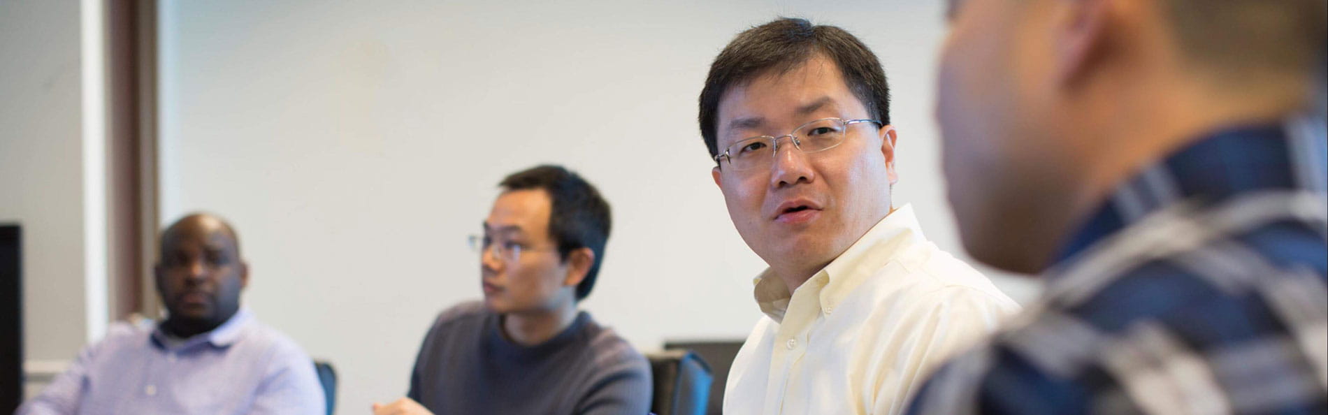 Bill Wang in a meeting